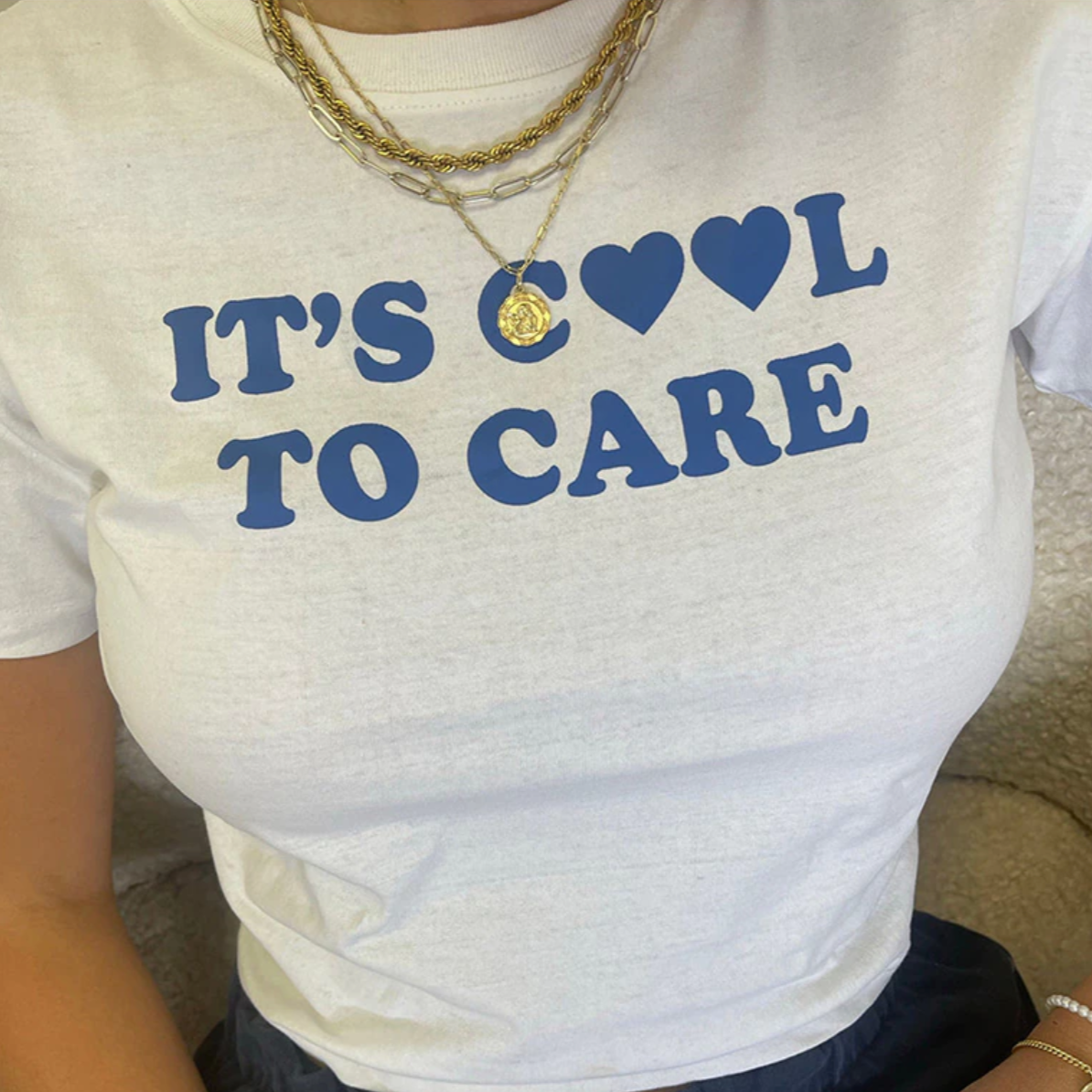 It's Cool To Care Baby Tee | Crop Top